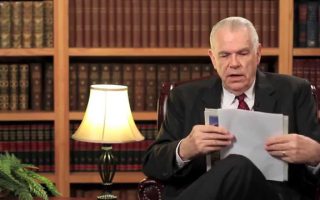 Why the Hammer and Sickle in Putin’s Backdrop?